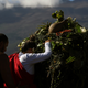 Native Hawaiian activists pray at the base of Hawaii’s Mauna Kea in background.